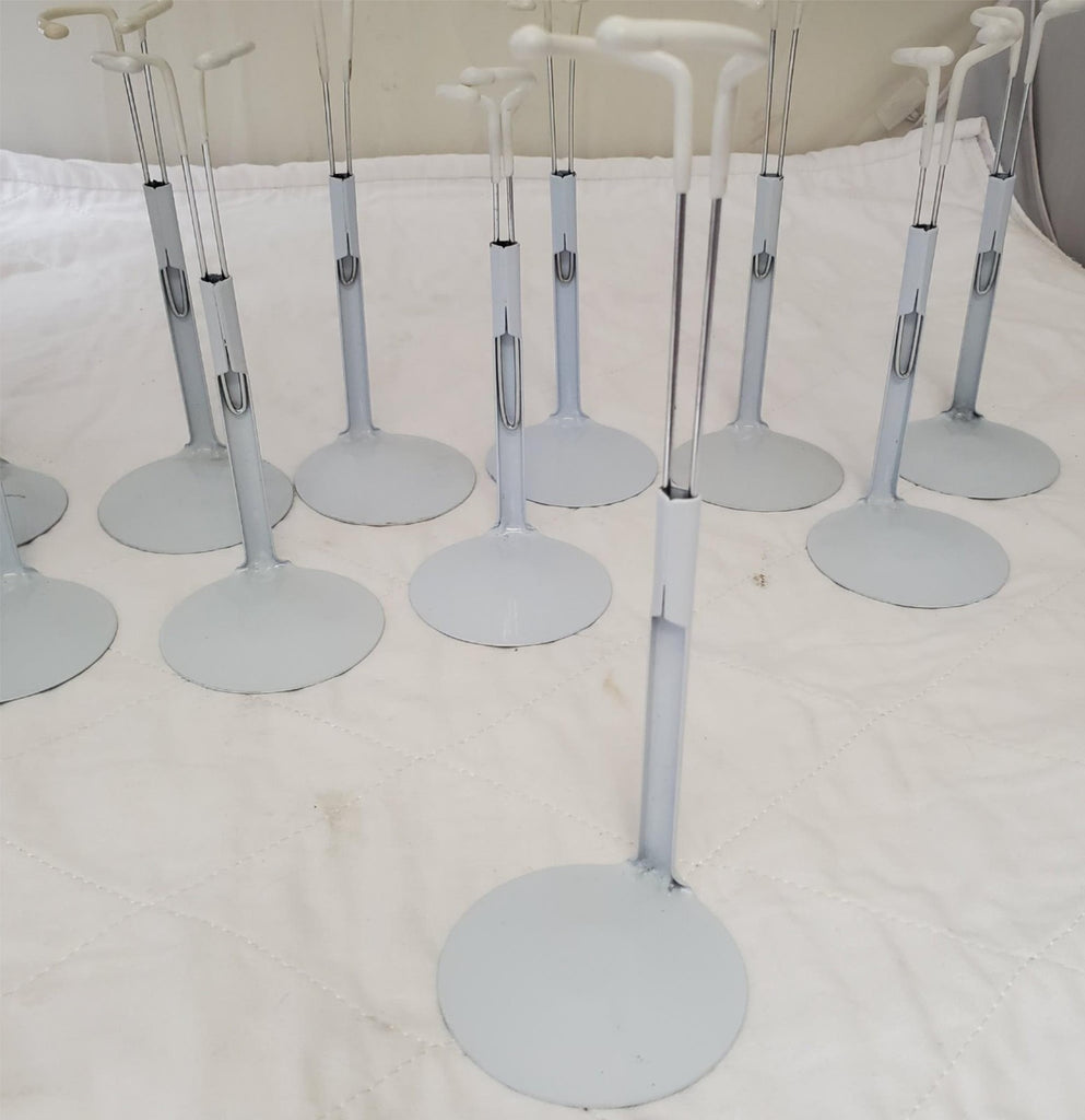 Lot of 13 Assorted White Adjustable Doll Stands
