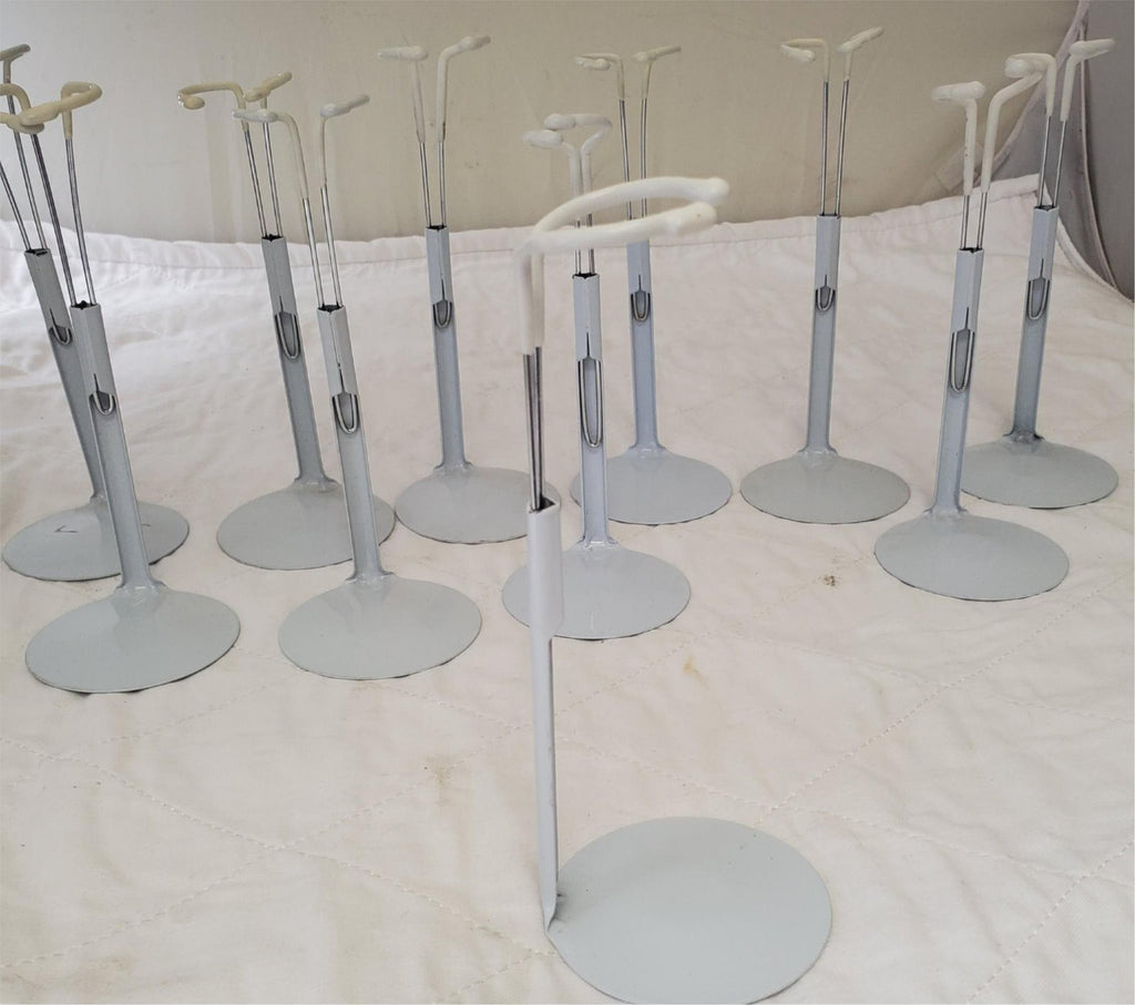 Lot of 13 Assorted White Adjustable Doll Stands