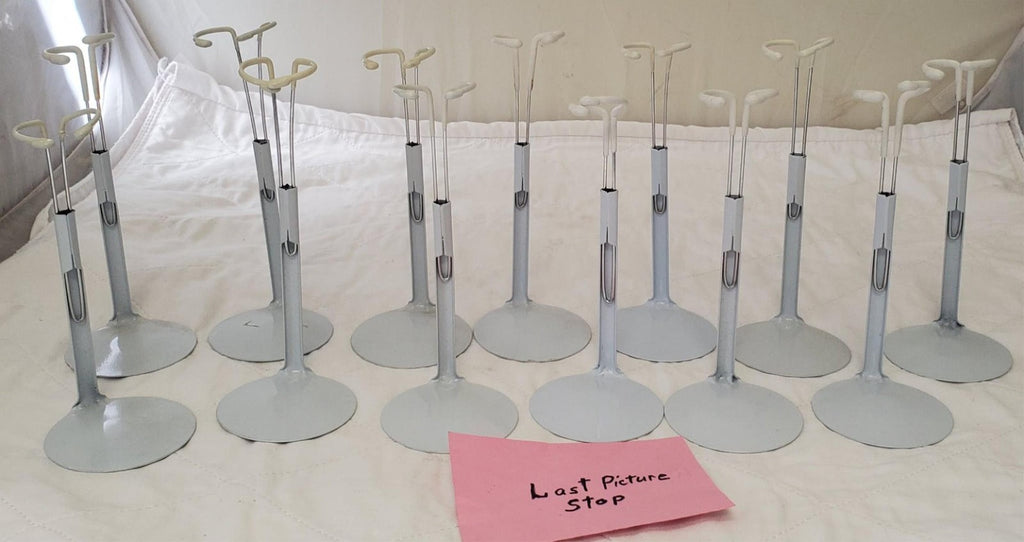 Lot of 13 Assorted White Adjustable Doll Stands