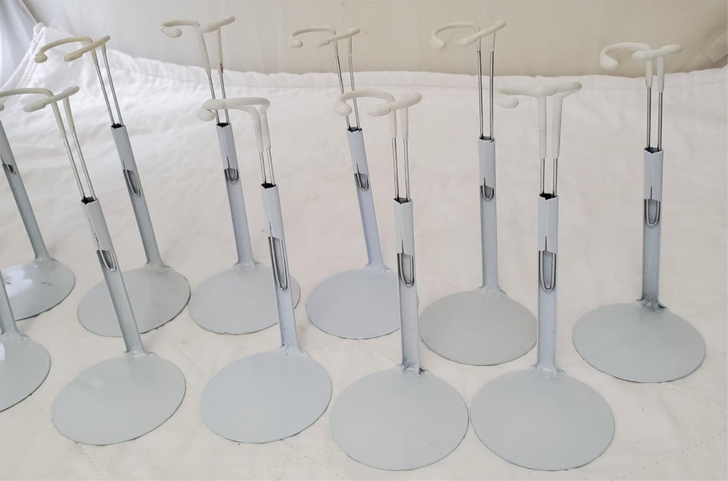 Lot of 13 Assorted White Adjustable Doll Stands