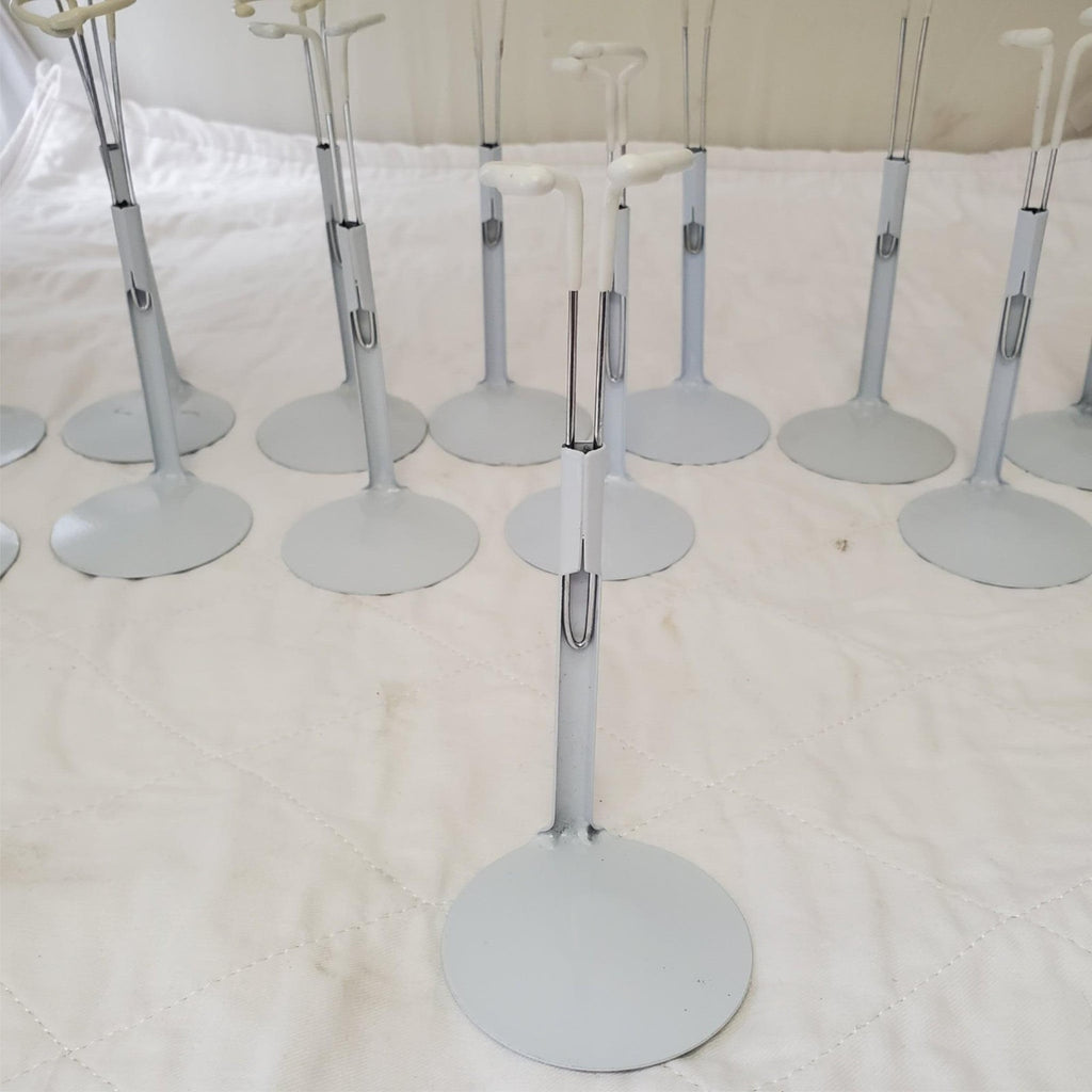 Lot of 13 Assorted White Adjustable Doll Stands