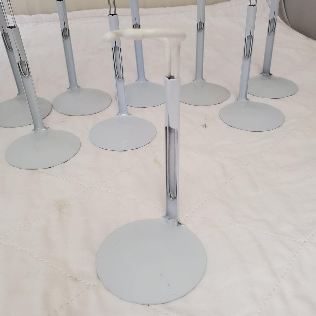 Lot of 13 Assorted White Adjustable Doll Stands