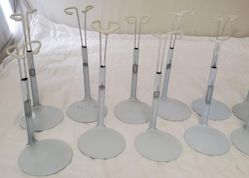 Lot of 13 Assorted White Adjustable Doll Stands